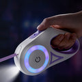 Retractable dog leash with built-in LED spotlight